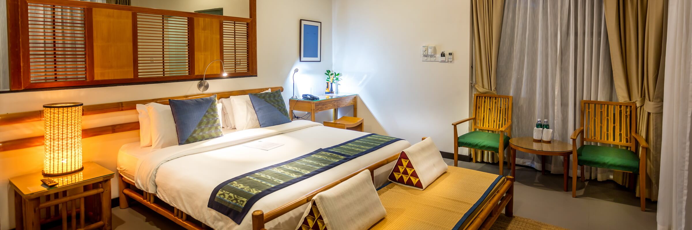 Die modern und hell eingerichteten Zimmer des River Resort Champasak.