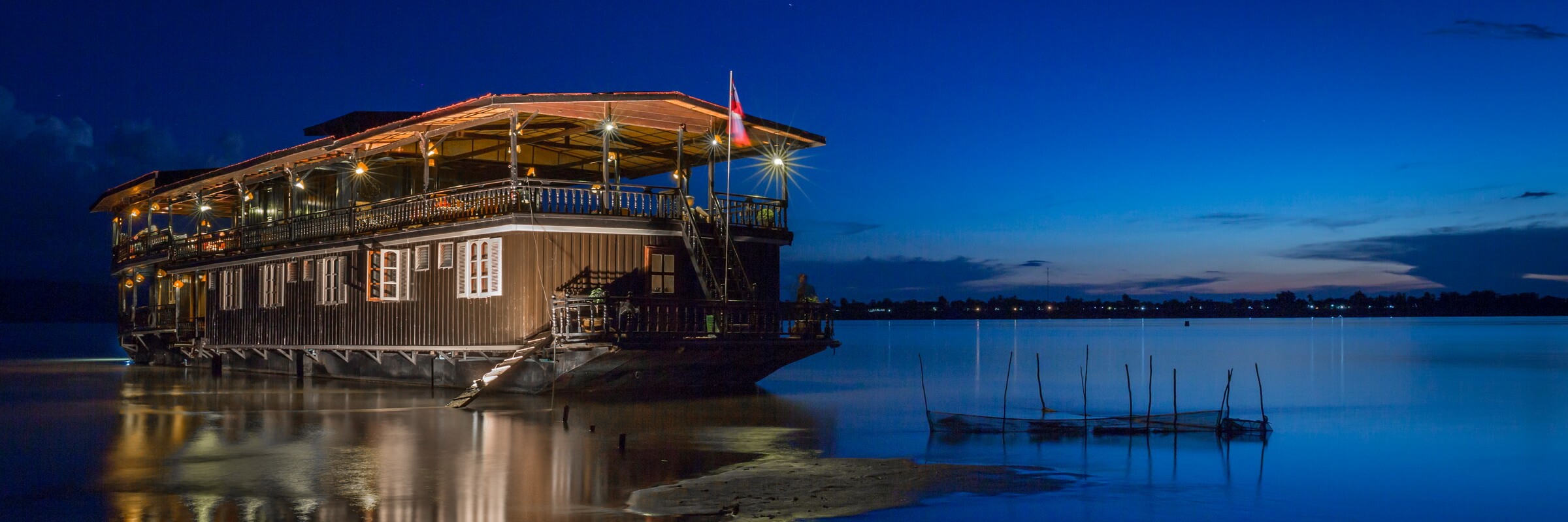 The Vat Phou boat, a floating hotel cruising on the Mekong River, Southern Laos